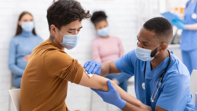 Covid-19,Vaccination.,Asian,Man,Receiving,Coronavirus,Vaccine,Intramuscular,Injection,In